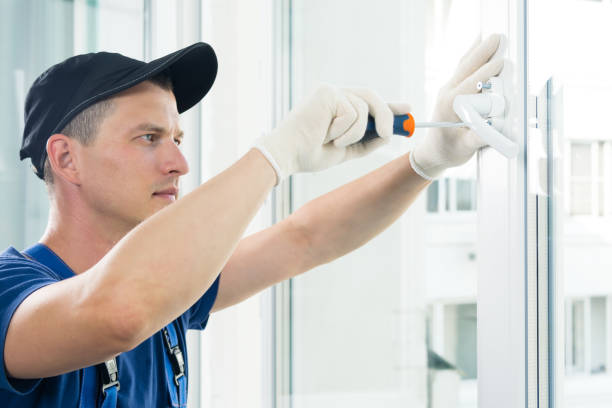 istock the hands of a worker fasten the handle to a plastic window,  view from the side 1175449405