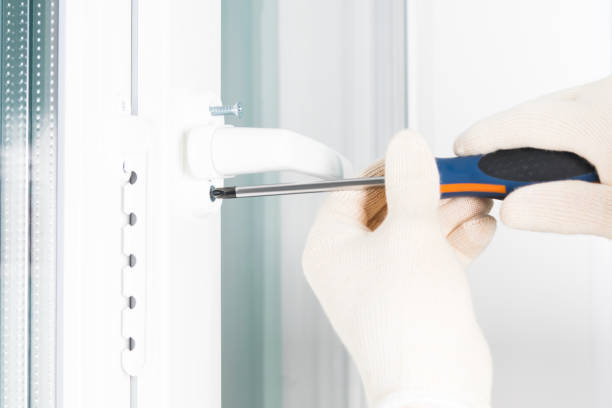 istock the hands of a worker fasten the handle to a plastic window, closeup view from the side 1175449417