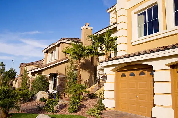 Photo of Neighborhood of yellow houses on sunny day