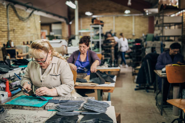 istock Mature ladies working at shoe factory 1175450866