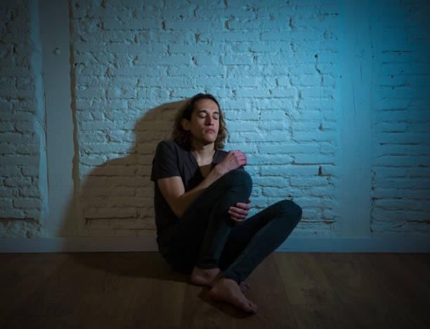 istock Devastated depressed millennial man crying sad feeling hurt suffering Depression. Teenager victim of bullying feeling lonely and depressed alone at home. Emotional pain Loneliness and Heartbroken. 1175452070