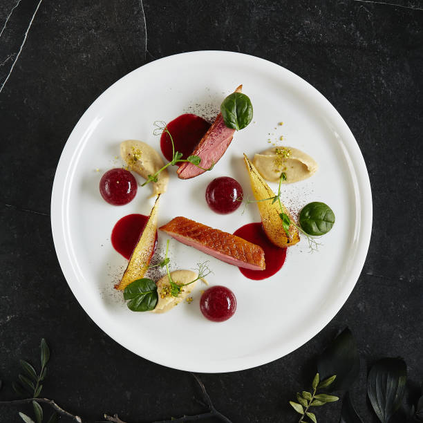 istock Exquisite Serving Creative Molecular Dish of Duck Breast, Baked Pear and Cherry Spheres Top View 1175453238