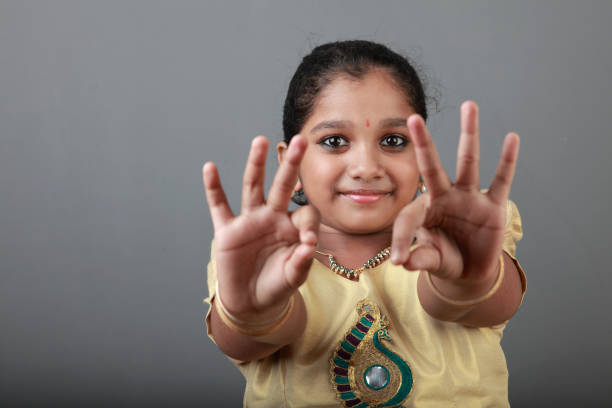 Little Girl Reach for Something on White Background