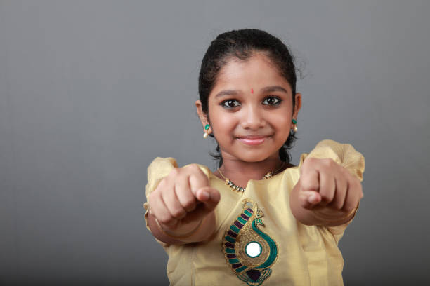 istock Happy little girls showing gestures 1175455017
