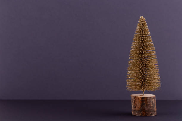 istock Christmas tree on pastel colored background. Christmas or New Year minimal concept. 1175455147