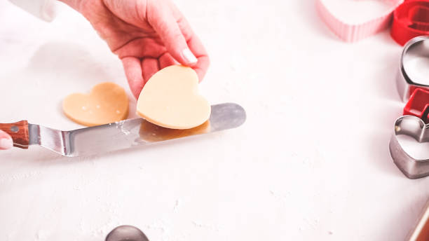 istock Cutting out shapes from sugar cookie dough 1175460488
