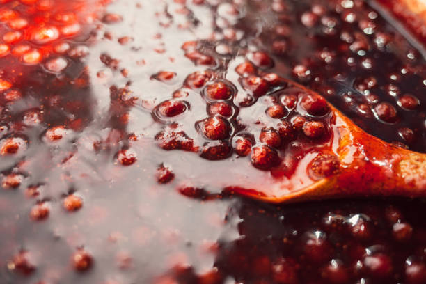istock a wooden spoon is immersed in strawberry jam 1175461154