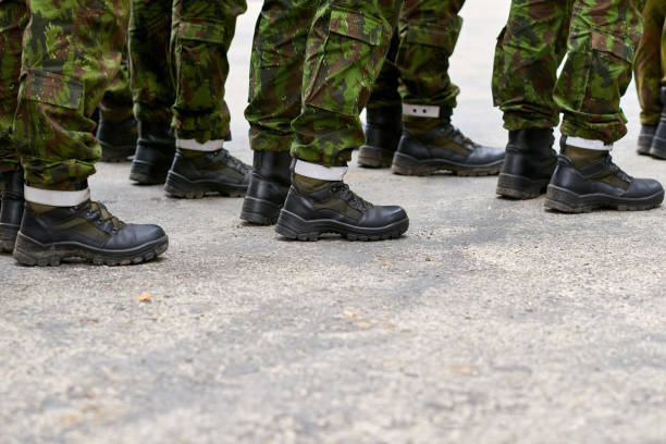 istock Military lineup, soldiers legs up close. 1175462004