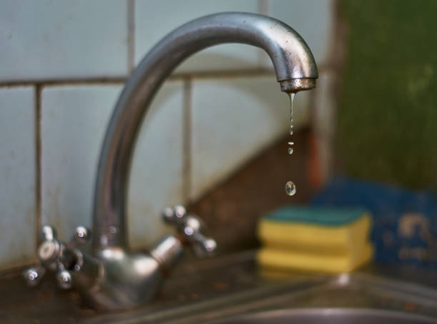 istock Old dripping kitchen faucet close up. 1175462585