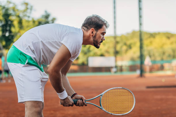 istock Man tennis player waiting for the ball 1175468677