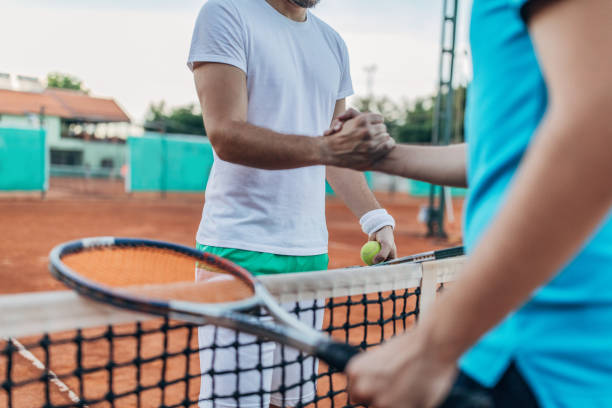 istock Tennis players handshake after game 1175469608