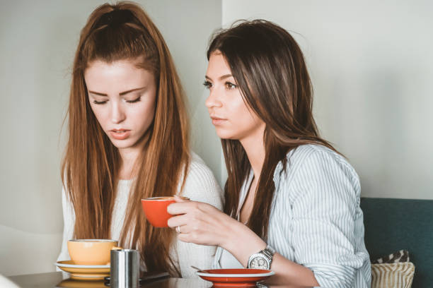 istock Young Female Friends is Having a Coffee Break 1175469674