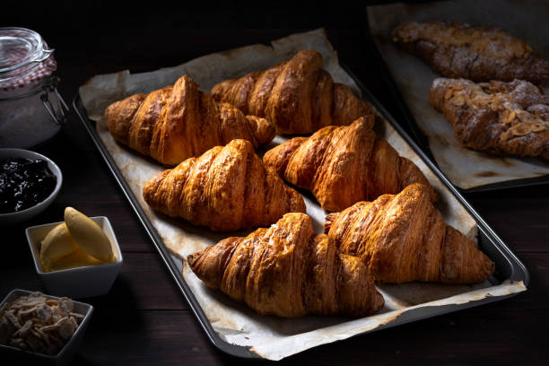 istock Croissants on an oven tray 1175469768