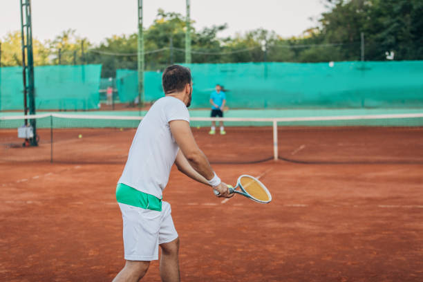 istock Man tennis player preparing to serve 1175470370