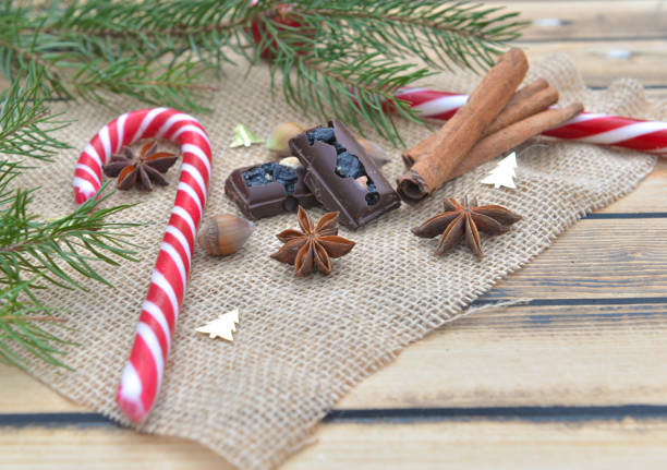 istock candy cane, chocolat and spices on natural textile on wooden table 1175471561