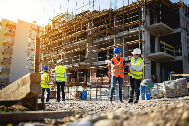 istock Four construction workers having meeting,stock photo 1175471894