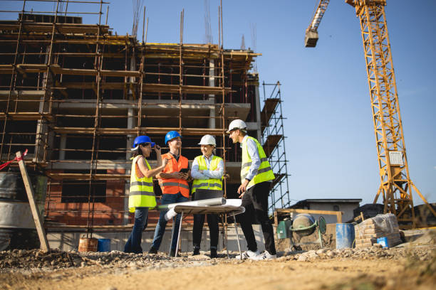 istock Four construction workers having meeting,stock photo 1175471899