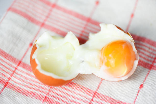 istock boiled egg on napery tablecloth on the table background top view - Soft boiled eggs , selective focus 1175471910