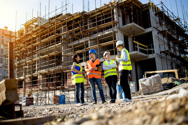 istock Four construction workers having meeting,stock photo 1175472011
