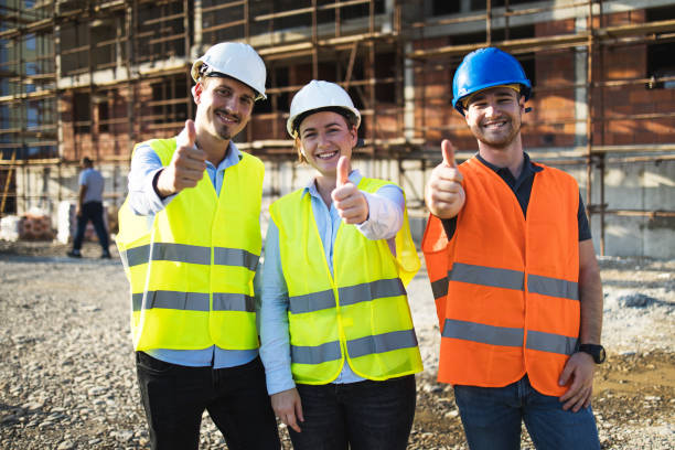 istock Three construction workers having meeting,pose for the photographer,stock photo 1175472140