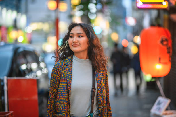 istock Contented Young Mongolian Vacationer Exploring Tokyo at Dusk 1175474247