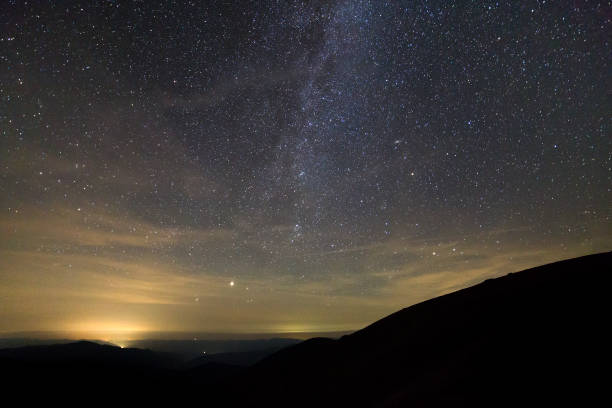 istock Night landscape of mountains with stars covered sky . 1175477541