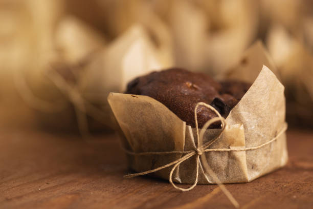 istock Tasty chocolate muffins on the wooden table 1175477596