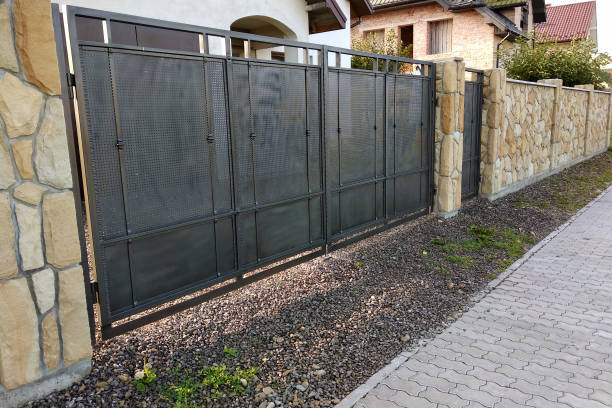 istock Cement slab pavement near natural stone fence or wall. 1175477672
