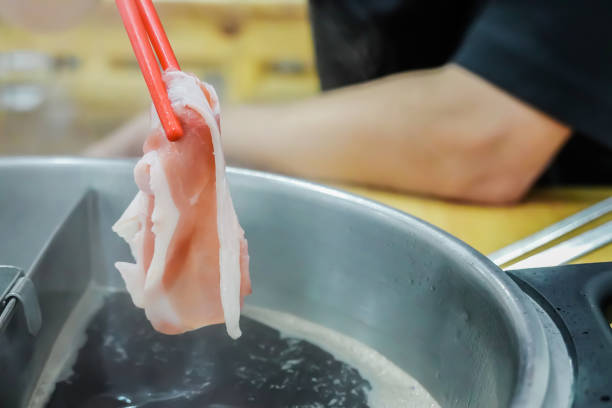 istock Delicious slice pork for shabu shabu in a hot pot 1175478004
