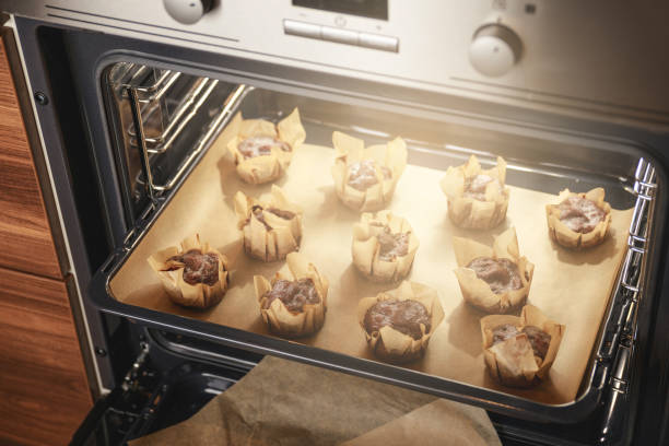istock Tasty baked muffins in the oven 1175481312