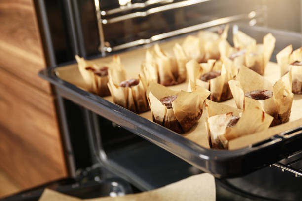 istock Tasty baked muffins in the oven 1175481352