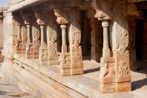 Pillars with intricate stone carving depicting legends from the Ramayana, Mahabharata and Siva Purana,  Lepakshi Temple,  Andhra Pradesh, India
