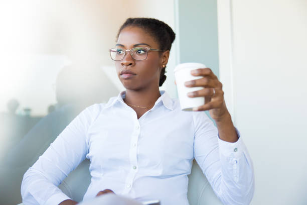 istock Pensive office employee enjoying coffee break 1175482336