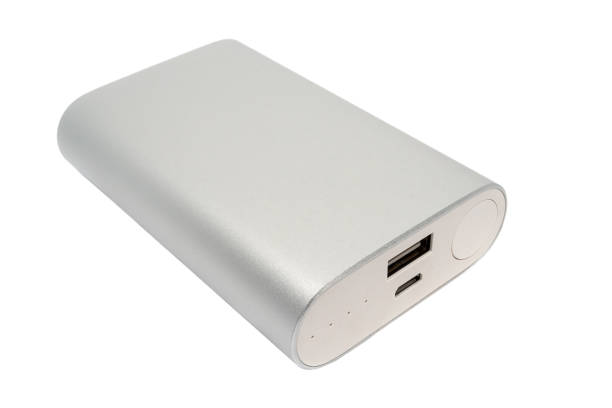 istock Closeup view of a rectangular silver power bank isolated on a white background. Charger for mobile phones, laptops and other electronic devices 1175483302