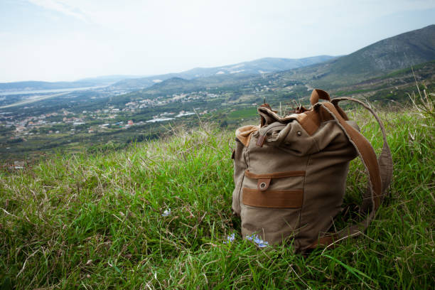 backpack on the grass at the top of the mountain in Croatia