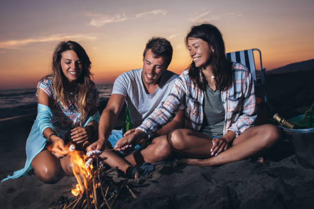 istock Happy friends partying on the beach with drinks 1175485500