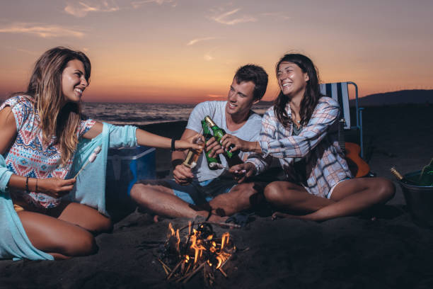 istock Happy friends partying on the beach with drinks 1175486937
