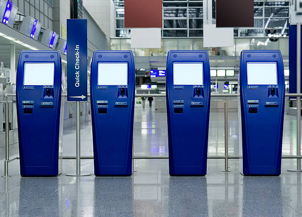 quick check-in counters at the airport - self service stockfoto's en -beelden