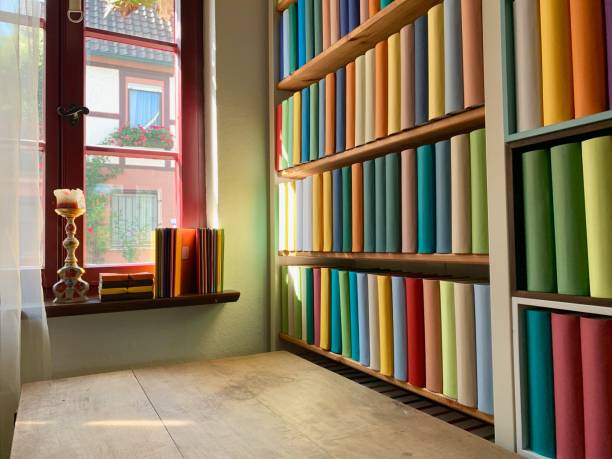 istock Desk and book shelves including generic books 1175492428