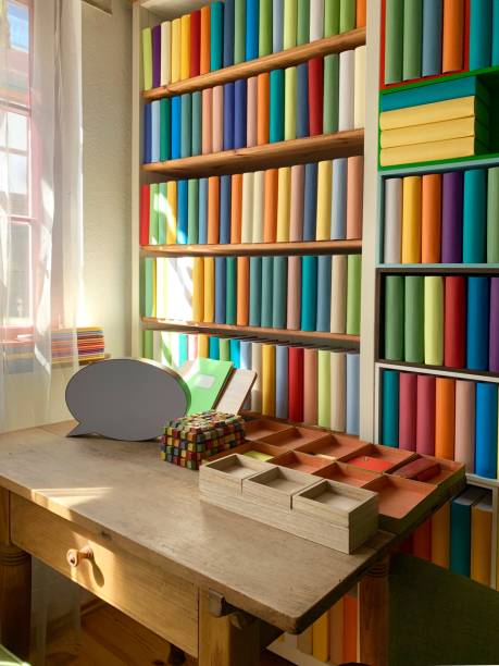 istock Desk and book shelves including generic books 1175492600