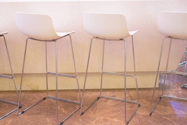 istock White chairs in bar counter in night pub 1175493760