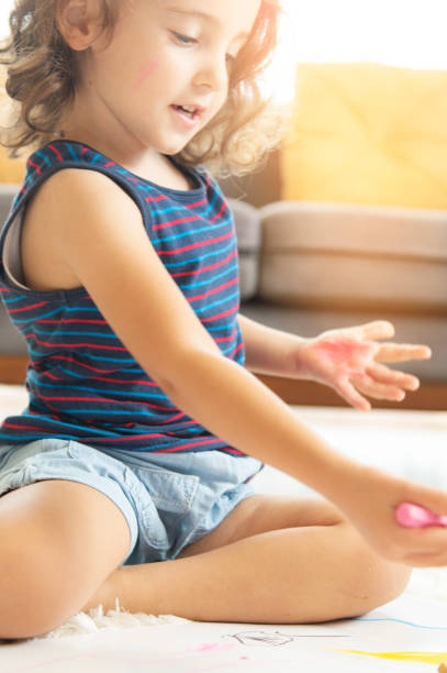 istock Little Girl drawing 1175495978
