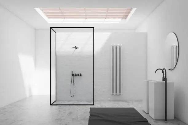 Interior of stylish bathroom with white walls, stone floor, shower stall with glass walls and double sink with round mirror above it. 3d rendering
