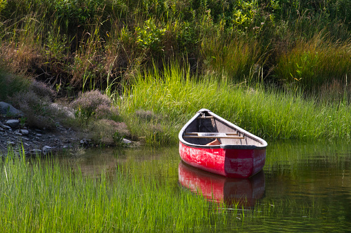 Clam Digger's Boat by salt marsh in Maine.