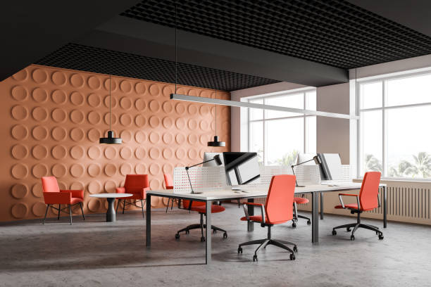 istock Bright orange office corner with lounge area 1175497772