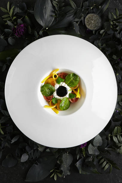 istock Stracciatella with Pickled in Olive Oil Tomatoes, Basil Marmalade and Cream 1175497878