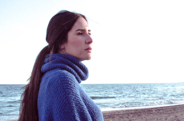 istock serious woman looks at the horizon 1175498100