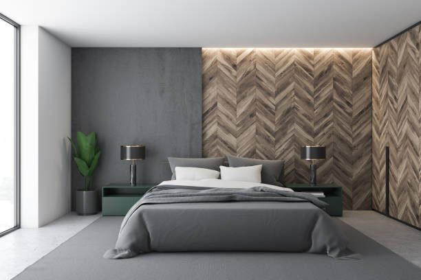 istock Gray and wooden master bedroom interior 1175499136