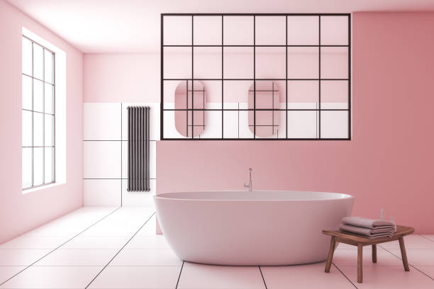 istock Pink and white tile bathroom interior with tub 1175499234