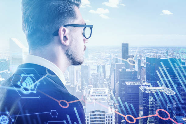 istock Businessman in glasses in city, digital graphs 1175499744